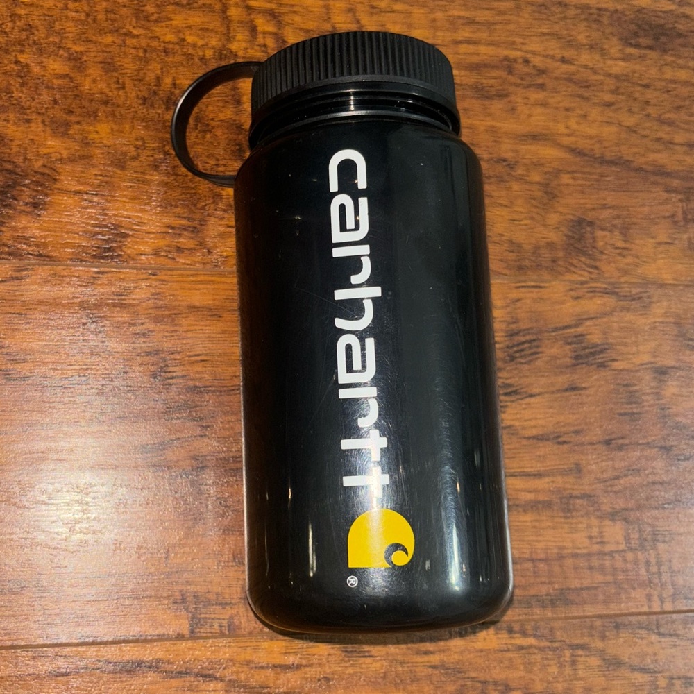 Carhartt 20 oz Black Water Bottle with Yellow Logo with attached Twist-Off Lid